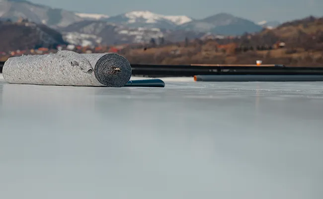 single-ply TPO PVC EPDM membrane being applied