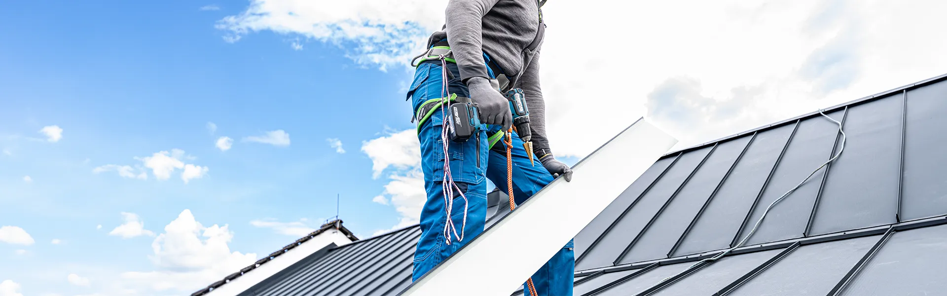 man installing a metal roof<br />
